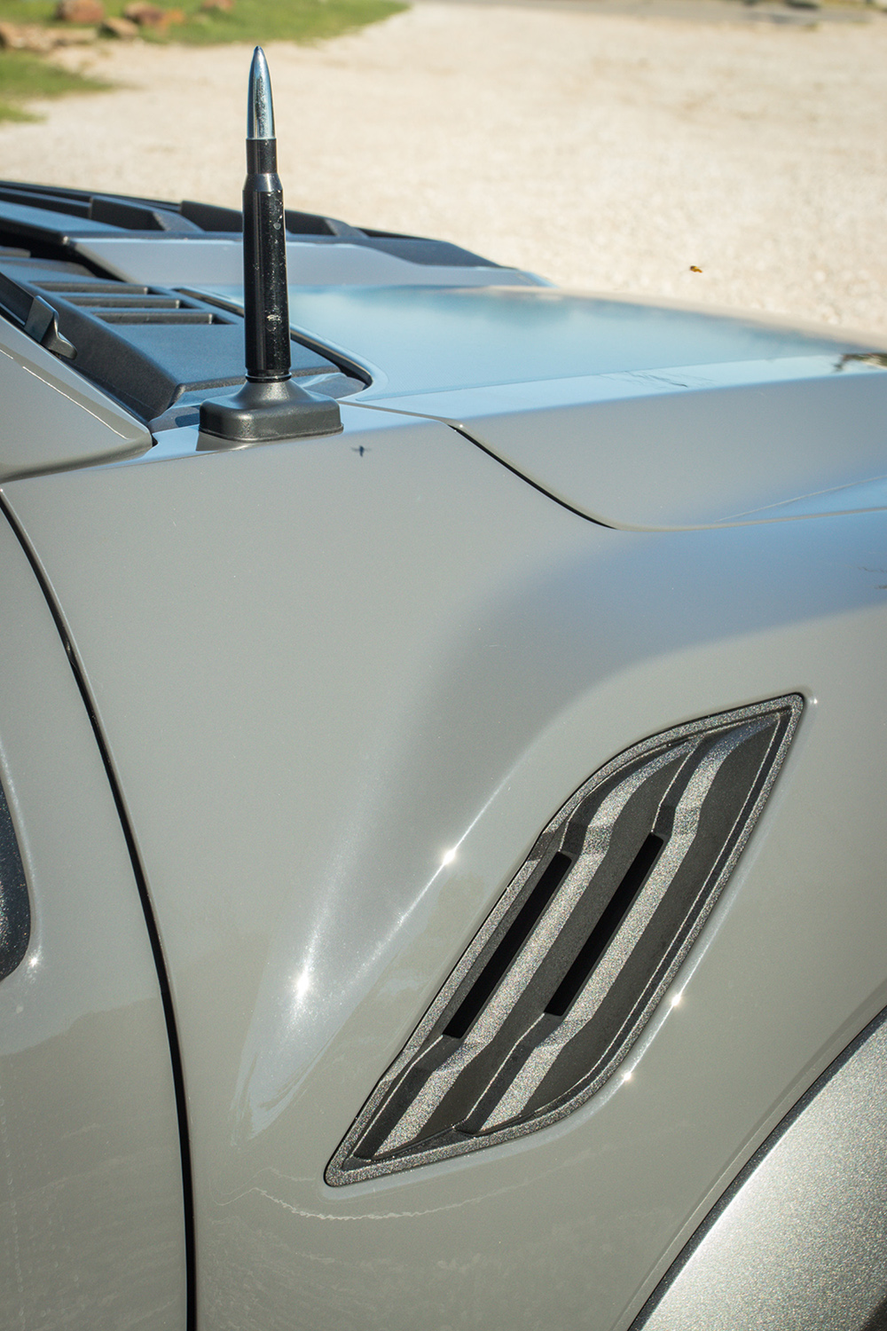 2018 ford f-150 raptor with custom bullet antenna in lead foot gray built by RAD-Rides dallas texas