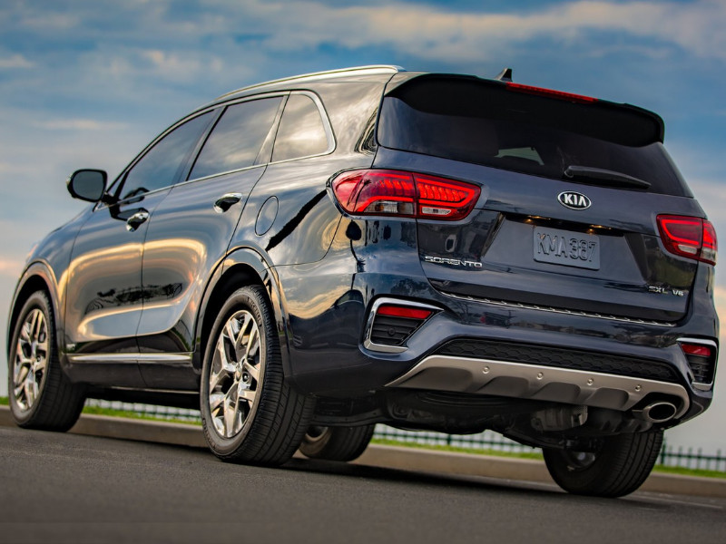 Back Side Exterior of a gray blue 2019 Kia Sorento parked on empty asphault opening