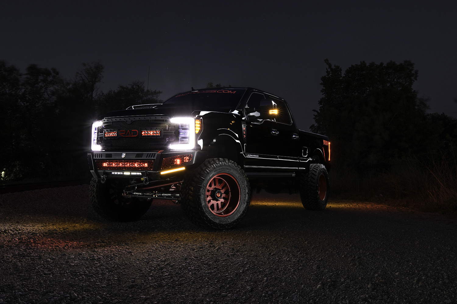 ford f-250 8 inch fabtech dirt logic coilovers fuel 22 inch forged wheels road armor identity bumpers with red powder coating and custom grill with rigid led lighting
