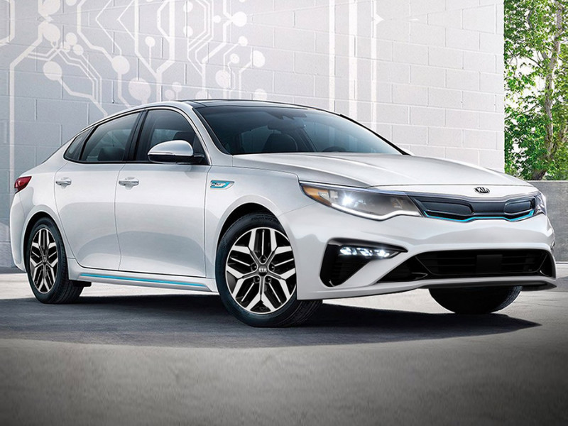 2020 Kia Optima plug-in hybrid parked in a garage unplugged from charging port