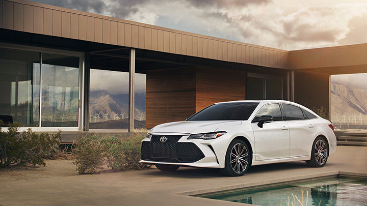 when to trade in your vehicle at Superior Toyota in Erie | White 2019 camry parked Outside a building White 2019 camry parked Outside a building