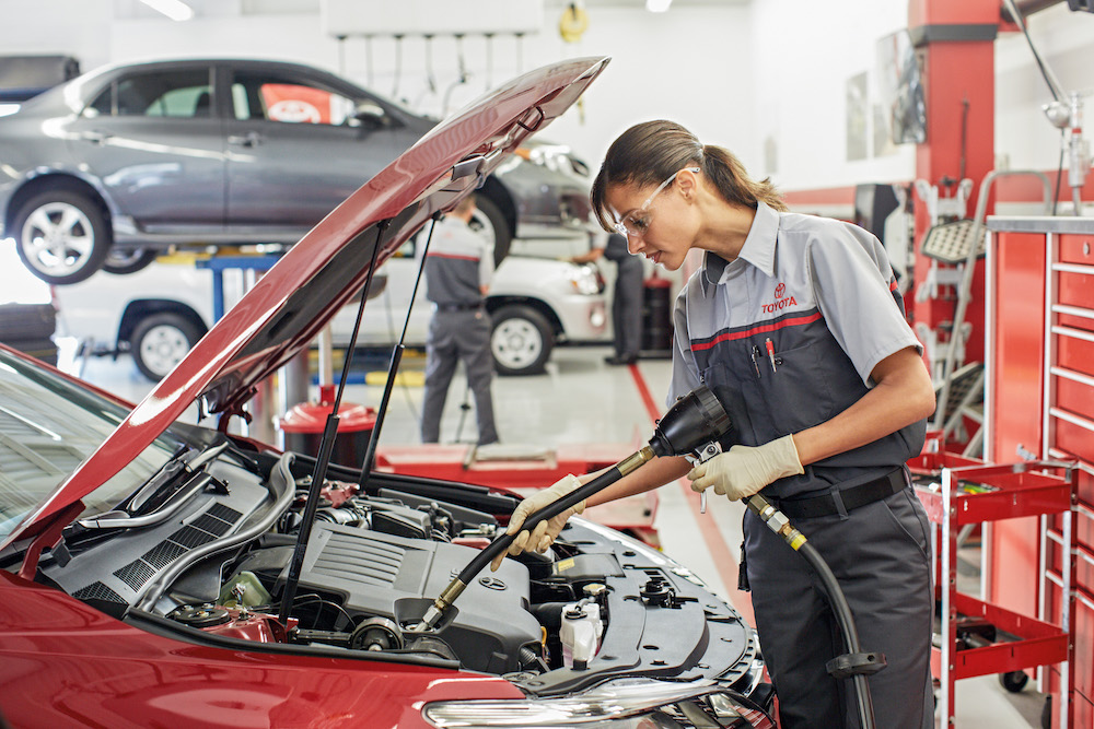 ToyotaCare in Erie at Superior Toyota | Toyota technicians checking car engine