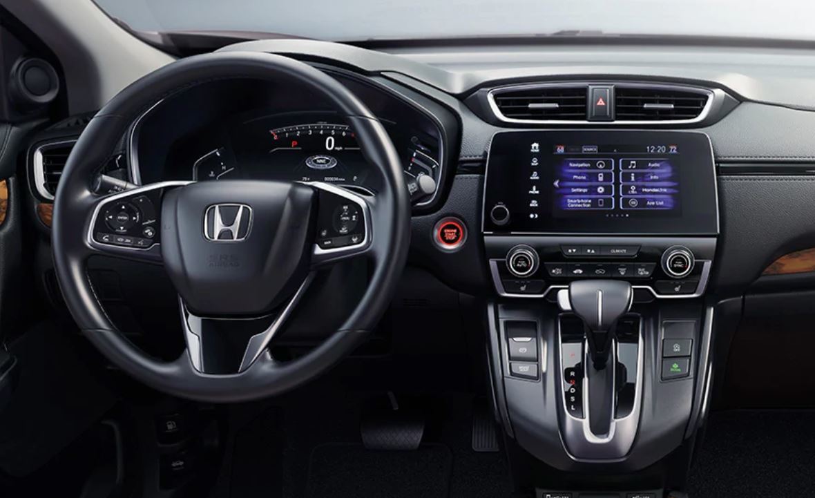 Una cabina que te ofrece lo que pides. Se muestra el Touring en cuero Ivory. El sistema de control de clima automático de dos zonas es una característica estándar en los modelos EX y superiores.