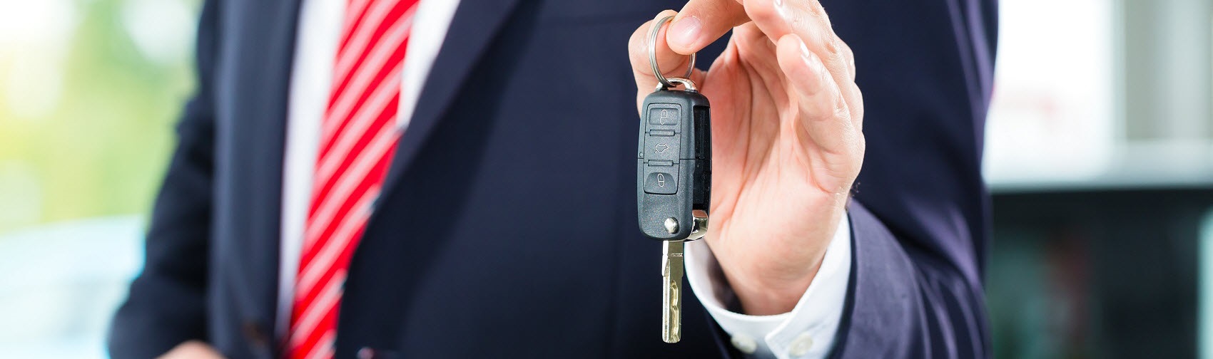 Close up of a person holding up a set of car keys
