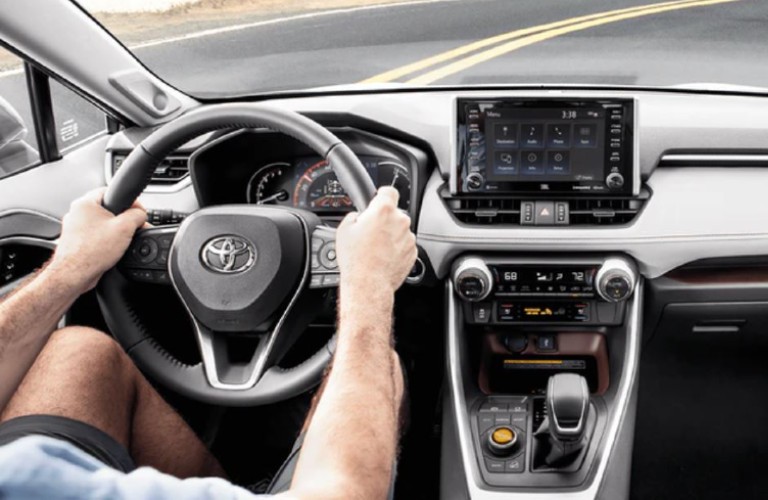 Person behind the wheel of the 2021 Toyota RAV4