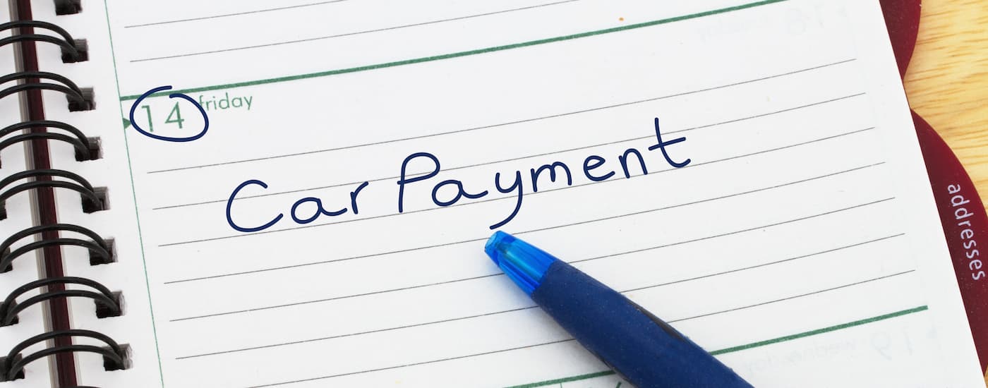 Car payment reminder handwritten on a calendar 