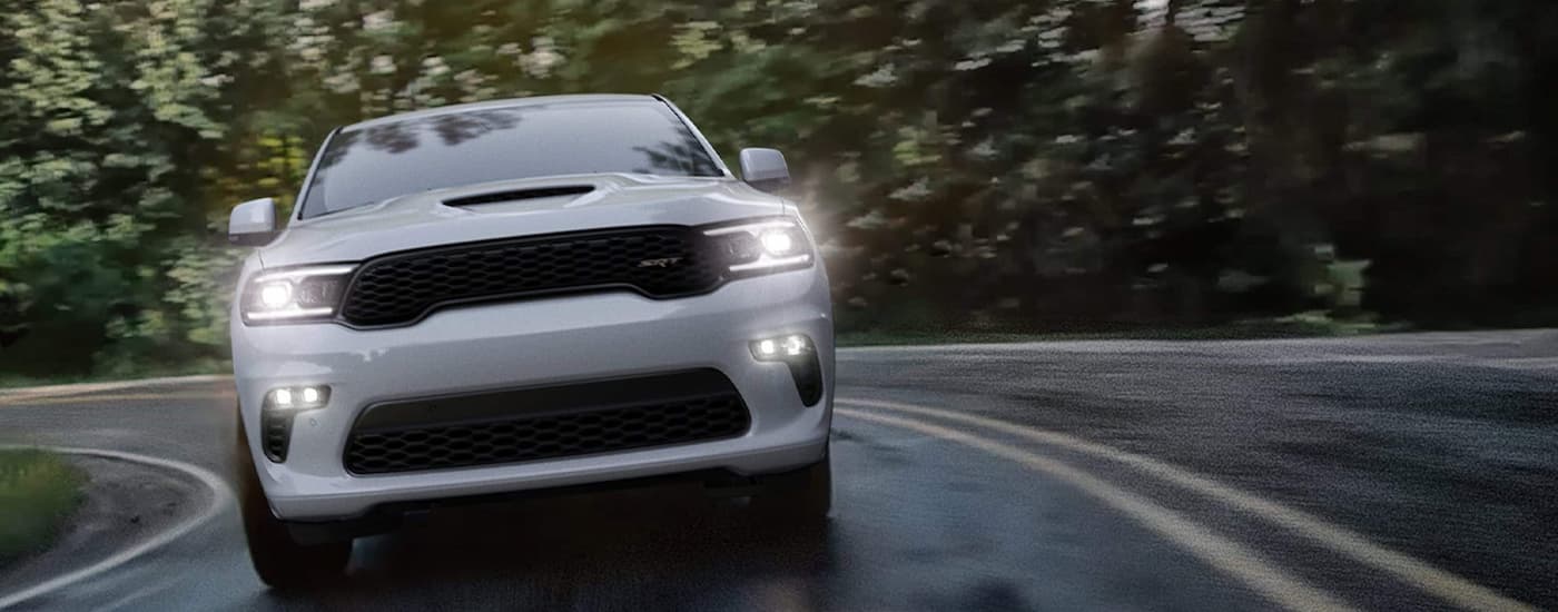 A white 2022 Dodge Durango SRT is shown from the front after leaving a Dodge dealer in Edmonton.
