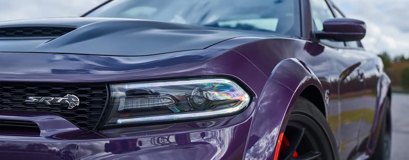A close up of the front of a purple 2022 Dodge Charger SRT Hellcat Widebody is shown. 