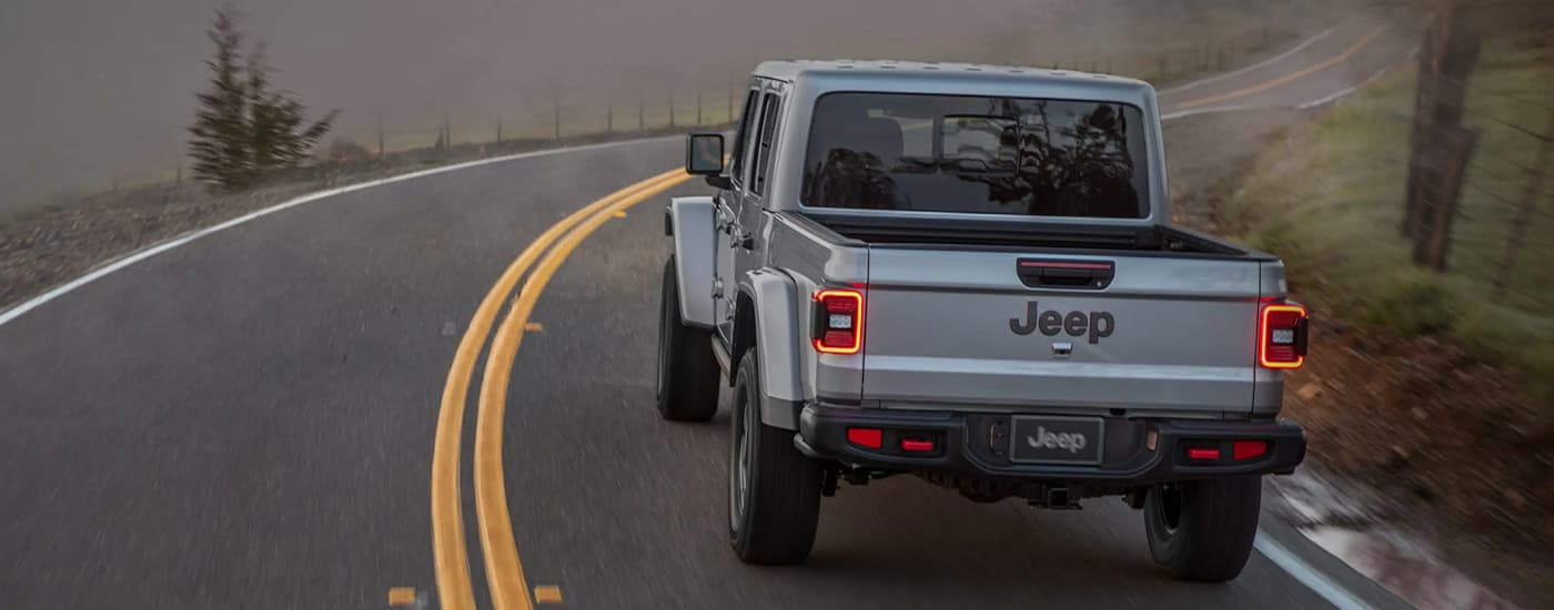 A silver 2022 Jeep Renegade is shown from the rear after leaving a used Jeep dealer.