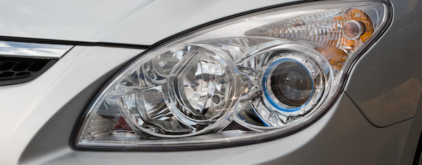 Close up of a silver 2009 Hyundai Elantra Touring headlight