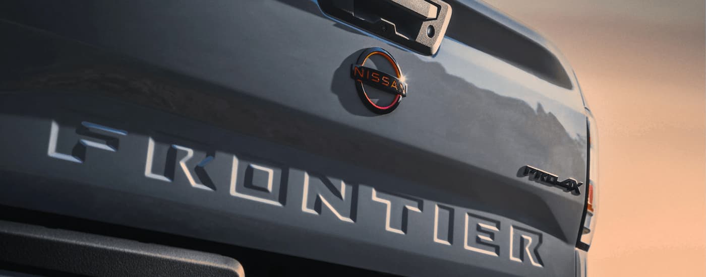 Close up of the tailgate of a grey 2022 Nissan Frontier PRO-4X.