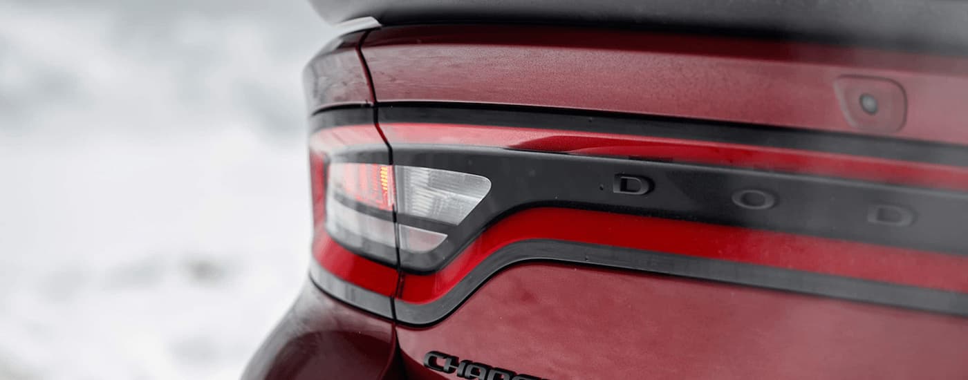 A close up of the rear taillight of a 2022 Dodge Charger is shown at a used Dodge dealer.