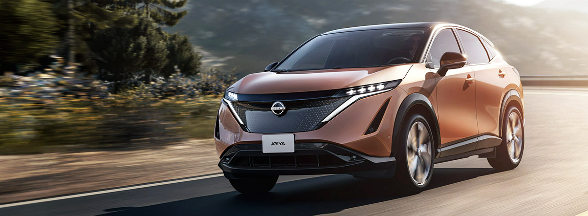 2023 ARIYA driving down mountain side road