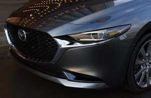grille and headlight of silver mazda3