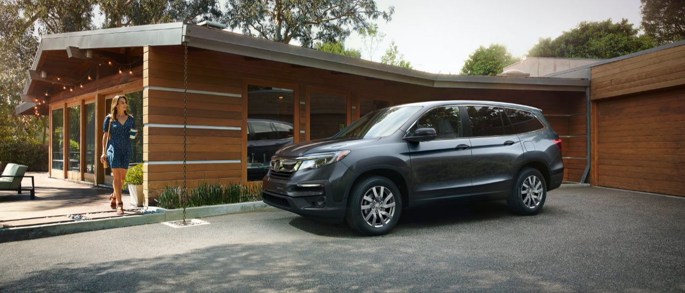 2022 Honda Pilot parked outside a house