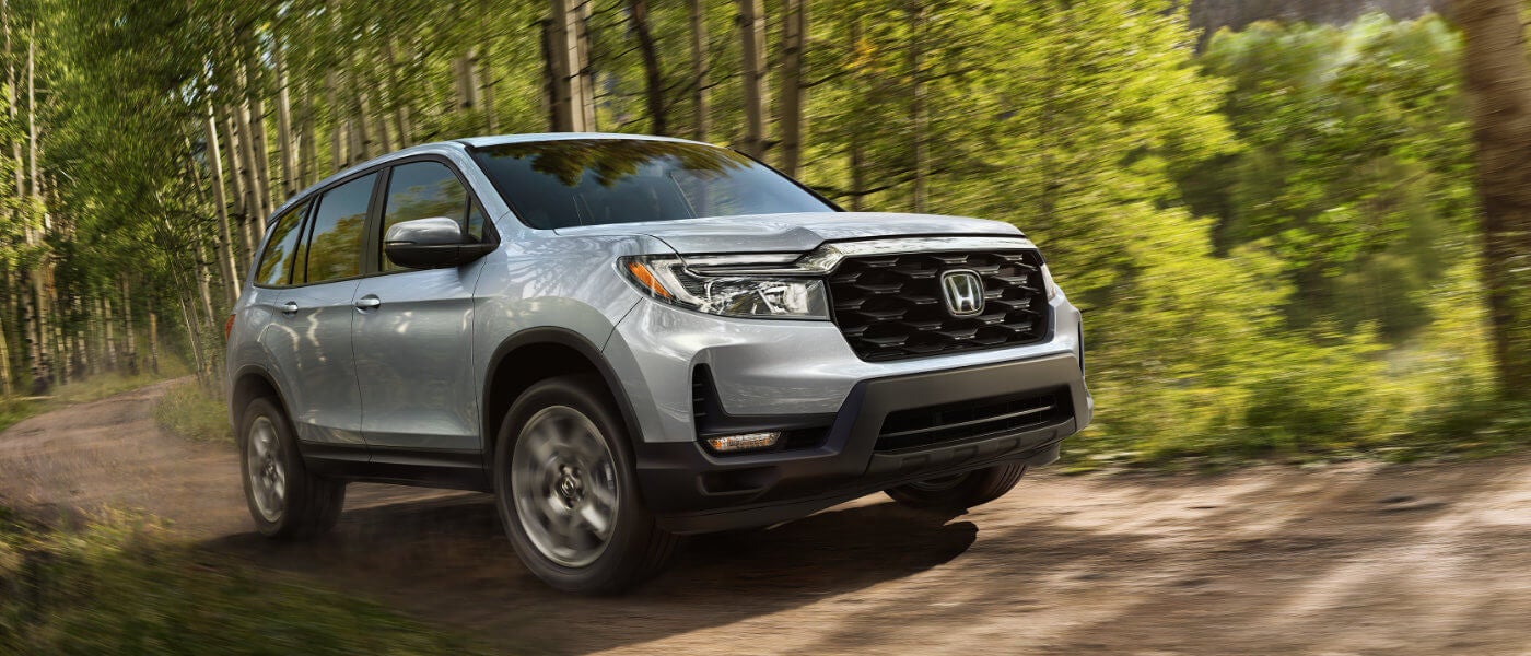 2022 Honda Passport driving in the forest