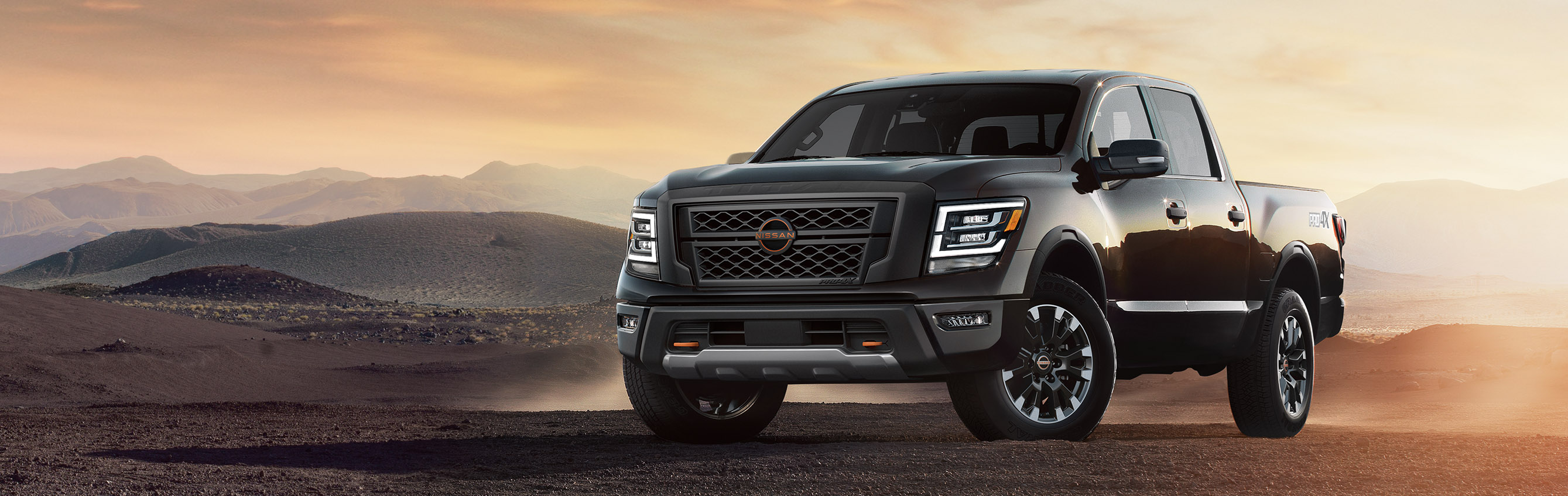 2023 Nissan Titan, black, parked in sandy nature scape