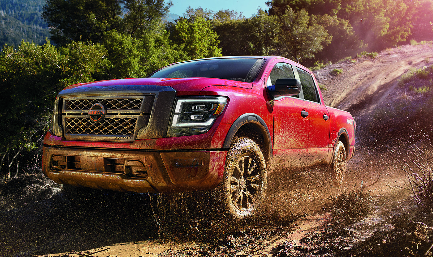 2023 Nissan Titan red, driving in mud
