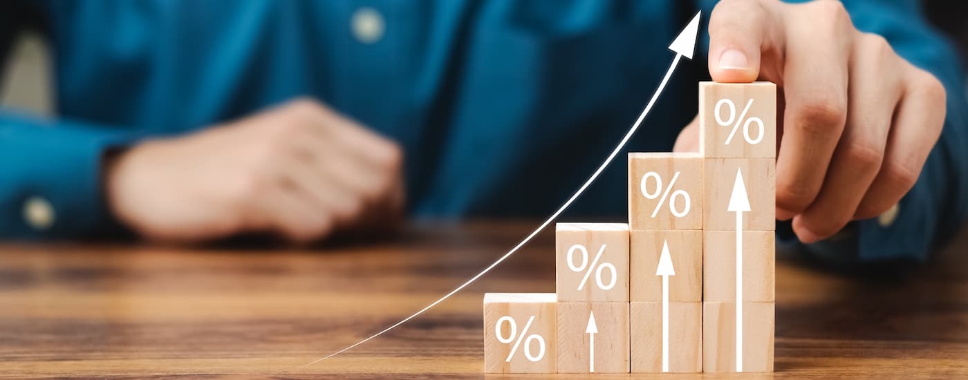 Wooden blocks are shown to demonstrate interest rates.