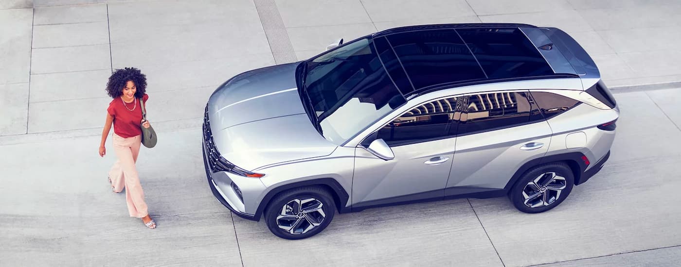 A silver 2023 Hyundai Tucson Limited is shown from a high angle on concrete after leaving a Hyundai dealership near Sherwood Park.
