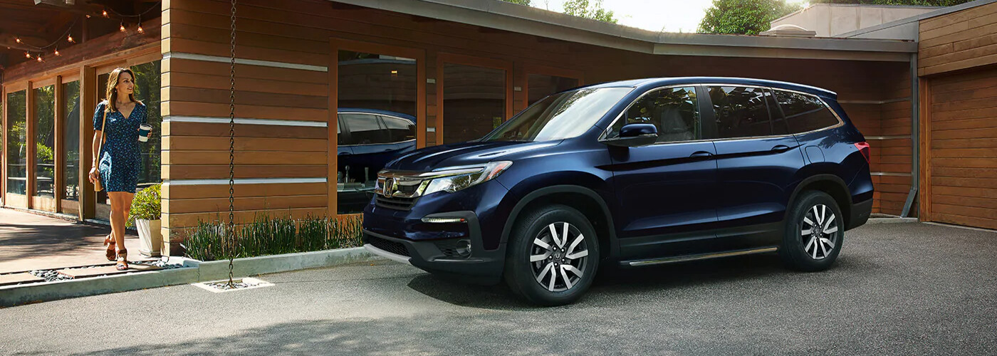 2021 Honda Pilot parked outside of a house