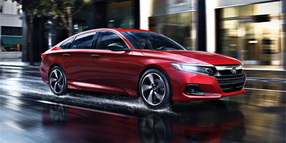 Red 2021 Honda Accord Driving on Wet Street