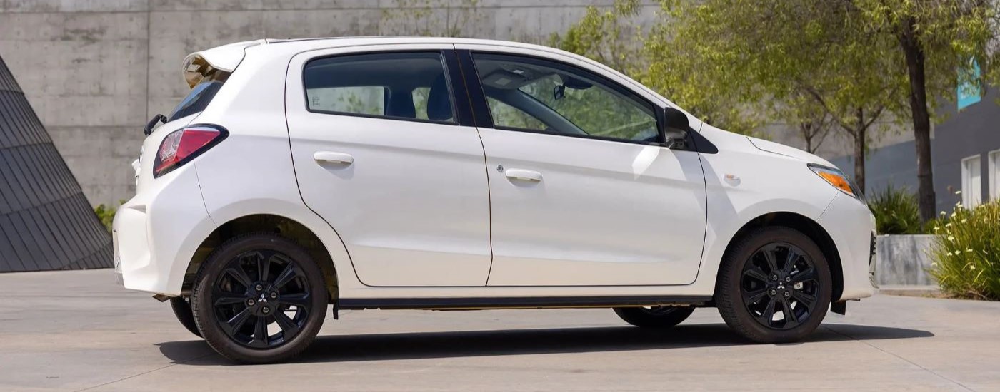 A white 2022 Mitsubishi Mirage for sale is shown from the side.