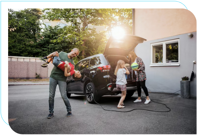 Family having fun with 2 children and electric vehicle in the background