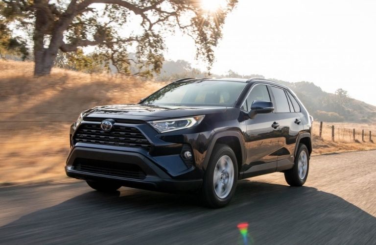 2021 Toyota RAV4 Hybrid driving on desert road