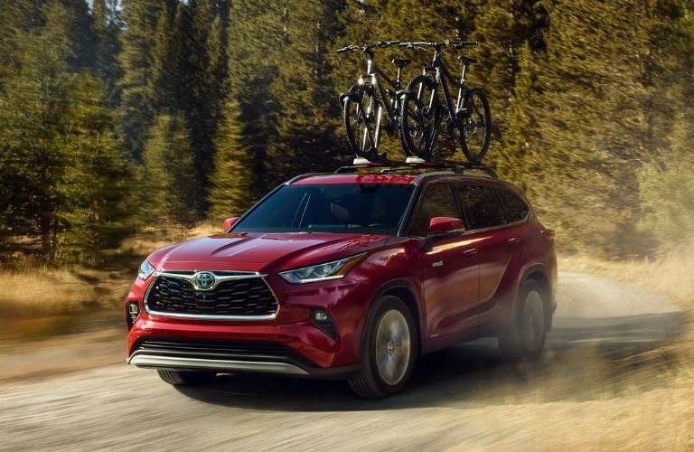 2021 Toyota Highlander Hybrid driving on dirt road