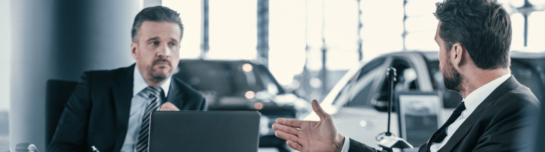 Car finance expert talking with a client