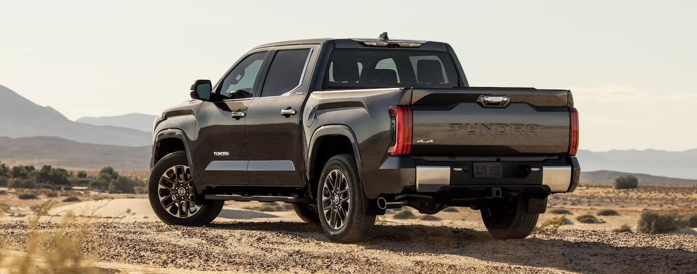 Rear view of a black 2022 Toyota Tundra parked in the desert.