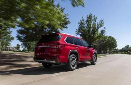 A red 2023 Sequoia on the road