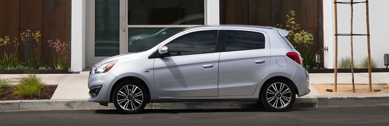2019 Mitsubishi Mirage white exterior driver side parked
