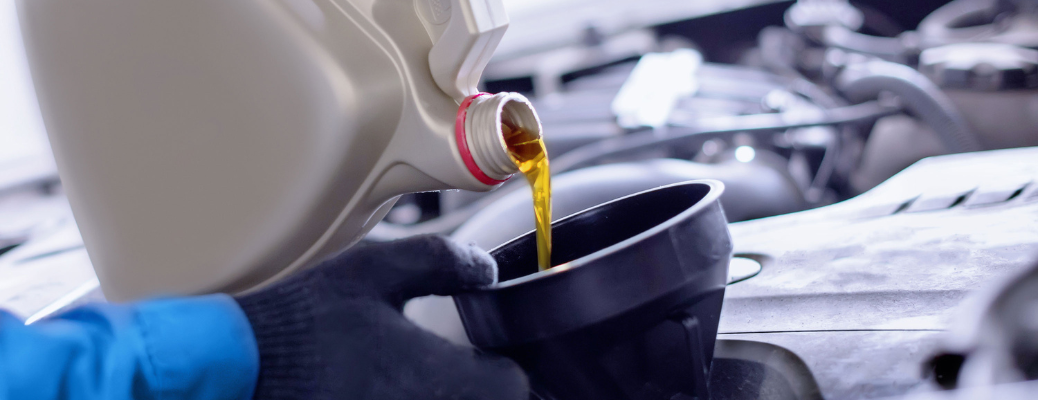 Oil being poured into a car's engine