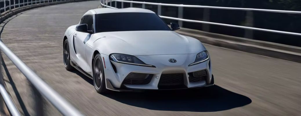 2023 Toyota GR Supra White driving on the road