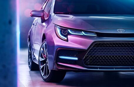 2020 Toyota Corolla close up of front end at angle in purple light