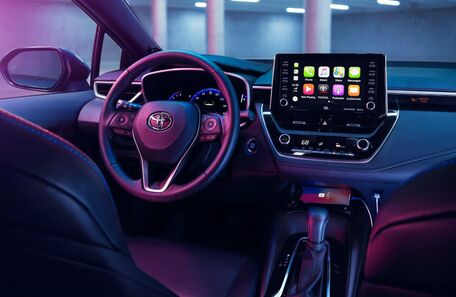 2020 Toyota Corolla purple interior view with screen on