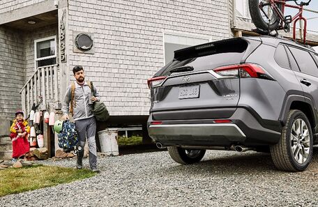 2021 Toyota RAV4 silver man and child about to enter