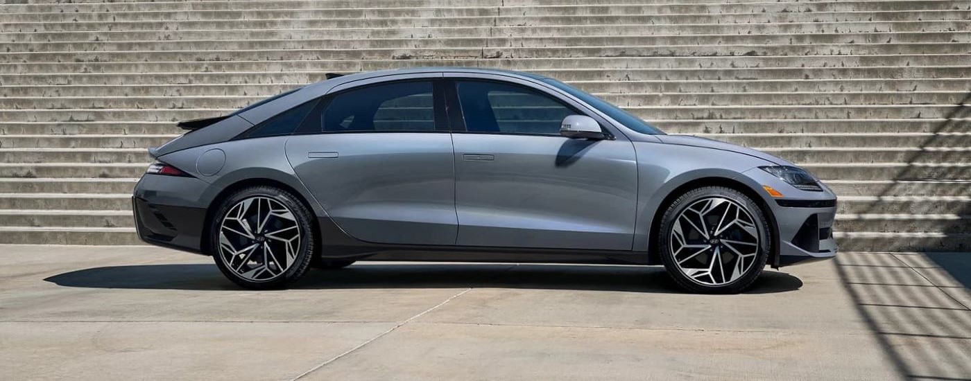 A silver 2023 Hyundai Ioniq 6 is shown near a staircase after looking at electric vehicles for sale.