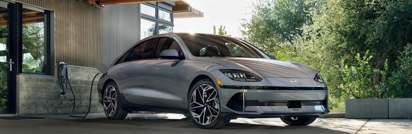 A grey 2023 Hyundai IONIQ 6 getting charged. 