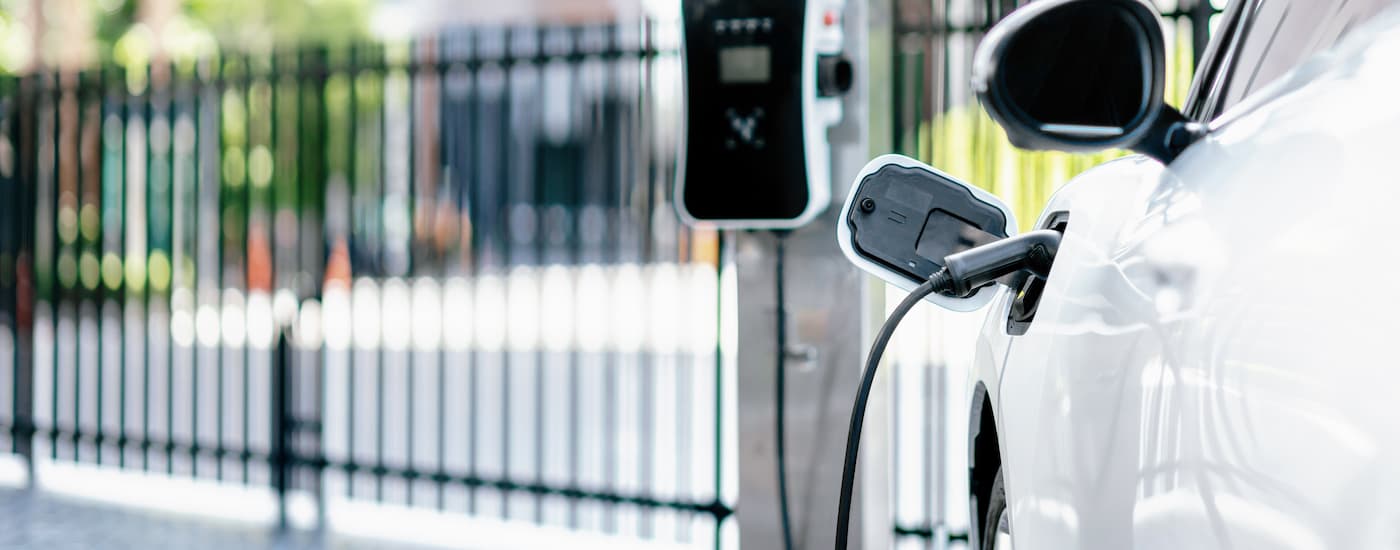 A close up of an electric vehicle for sale charging is shown.