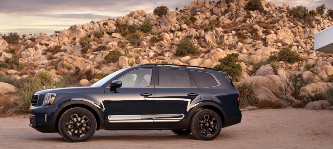 The hood of this SUV is almost as tall as the small car. I wonder