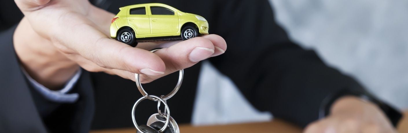 A man holding a key chain