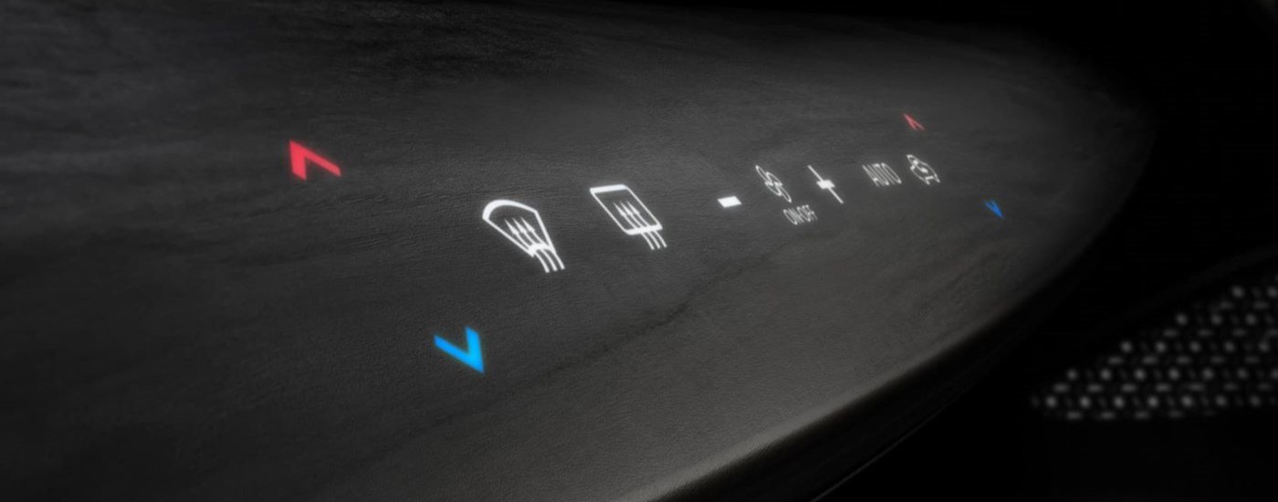 Thr HVAC control buttons are shown in a 2023 Nissan Ariya.