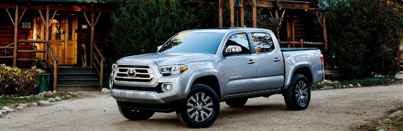 2022 Toyota Tacoma Gray parked outside a cabin