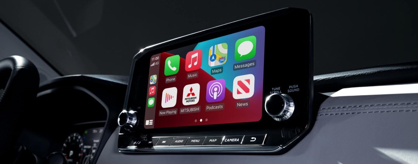 A close up shows the apps and infotainment screen in a 2023 Mitsubishi Outlander PHEV.