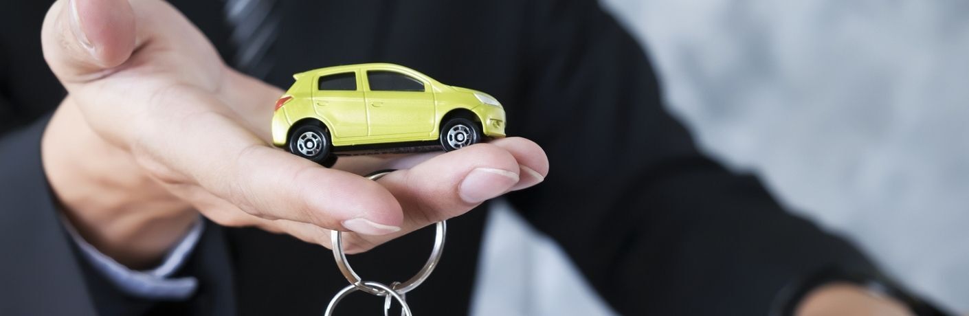A man holding a key chain