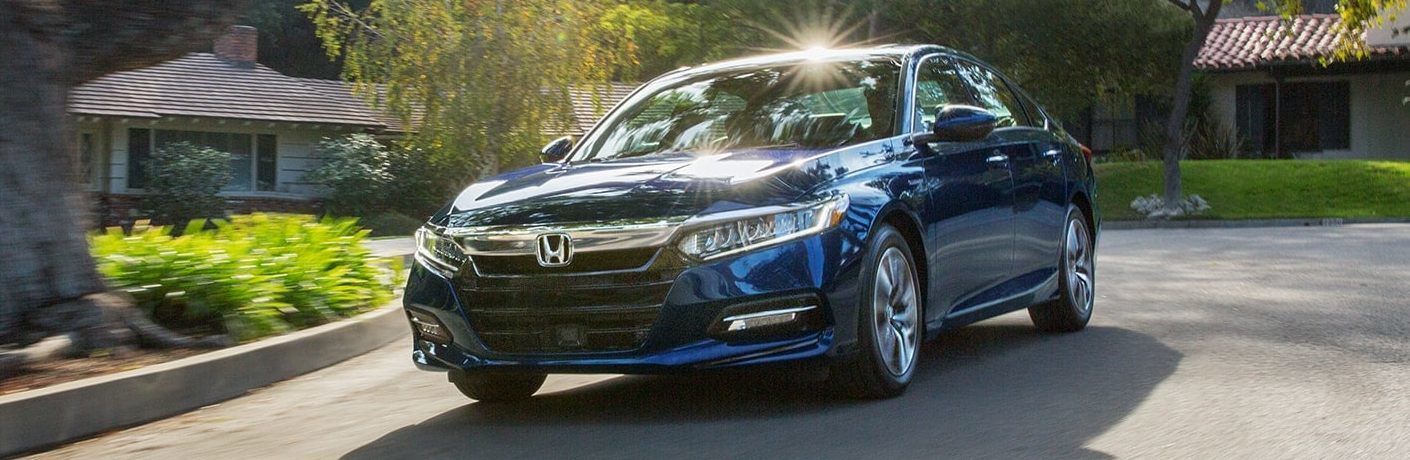 Blue 2021 Honda Accord Hybrid in suburban area