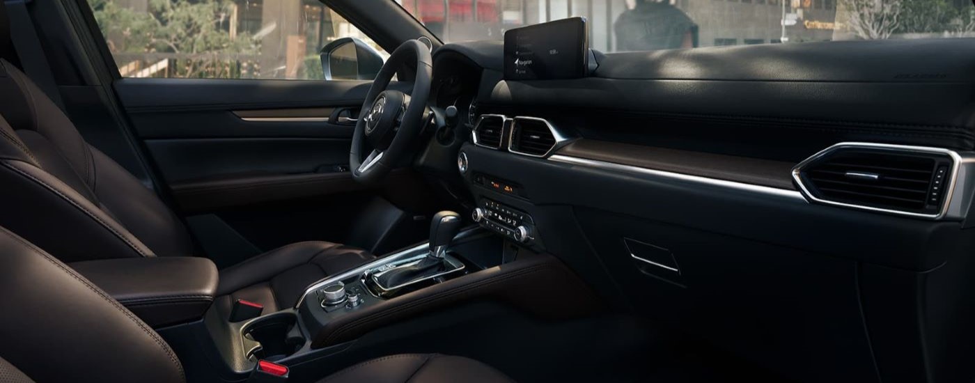 A close up shows the black interior in a 2023 Mazda CX-5.